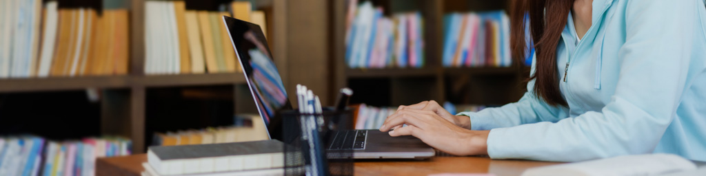 A student typing on a computer