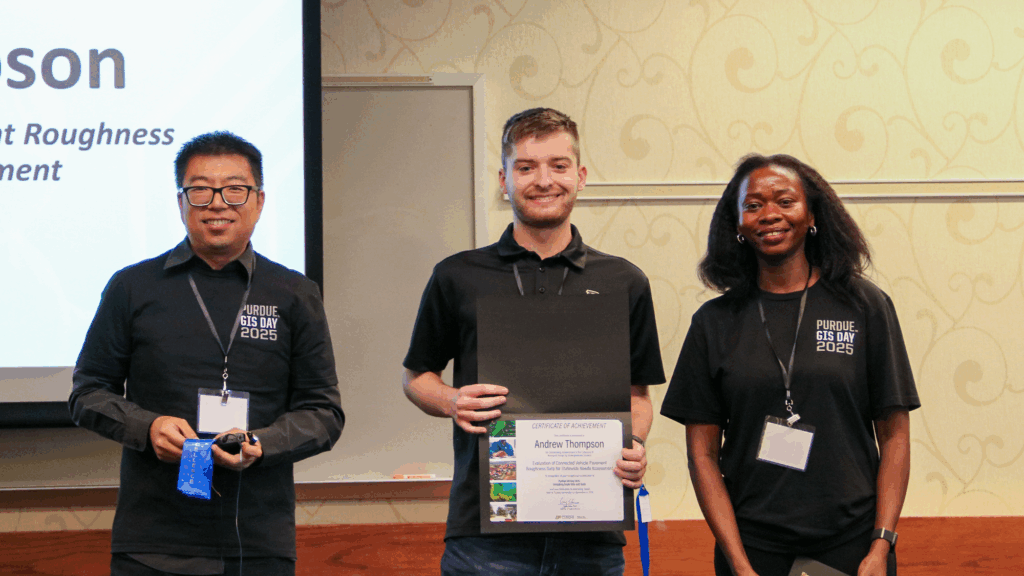 Undergraduate award winner Andrew Thompson holding certificate with Gang Shao, director and Innocensia Owuor , faculty member