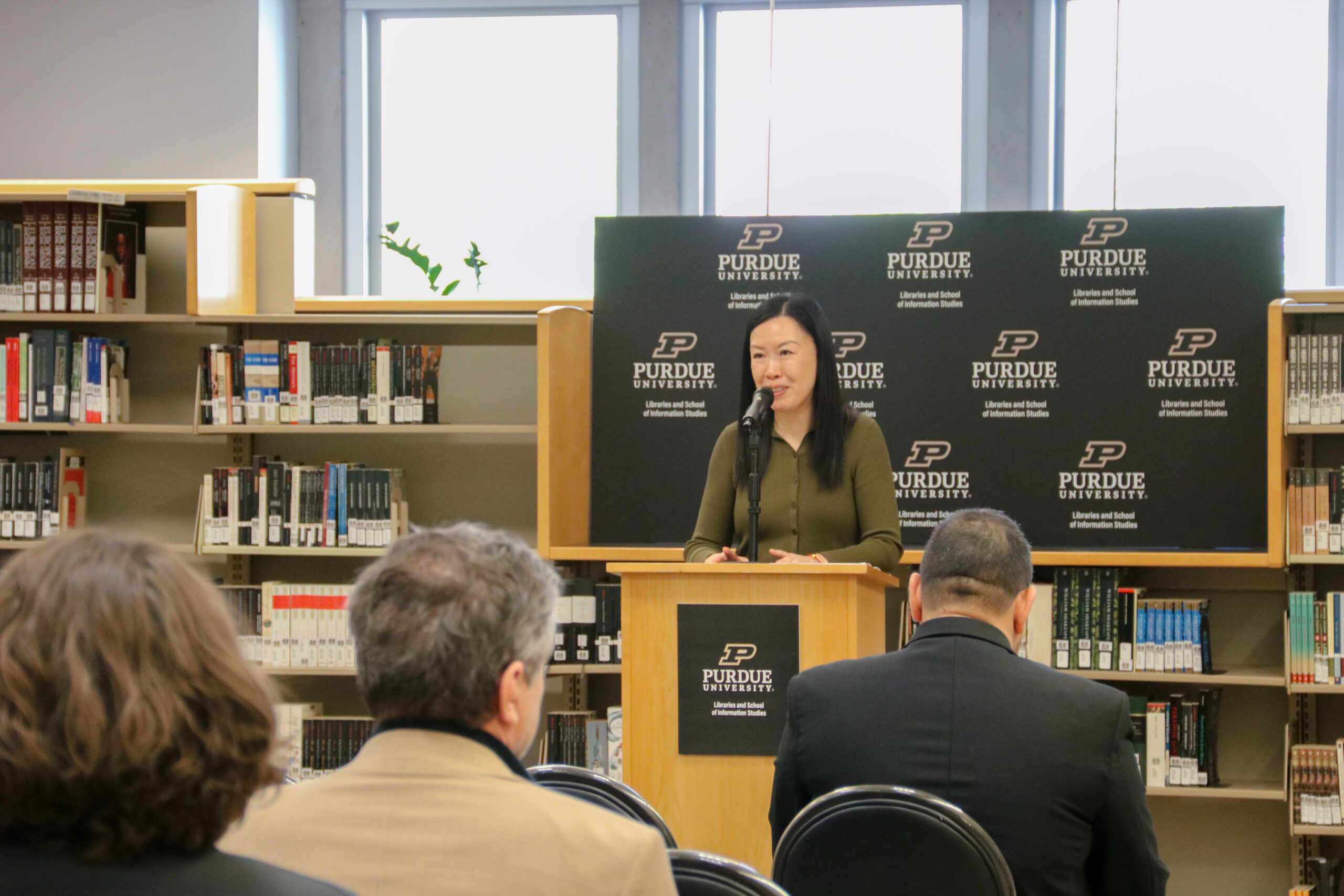 Nicole Kong at podium for Celebration of Books event in Cornerstone