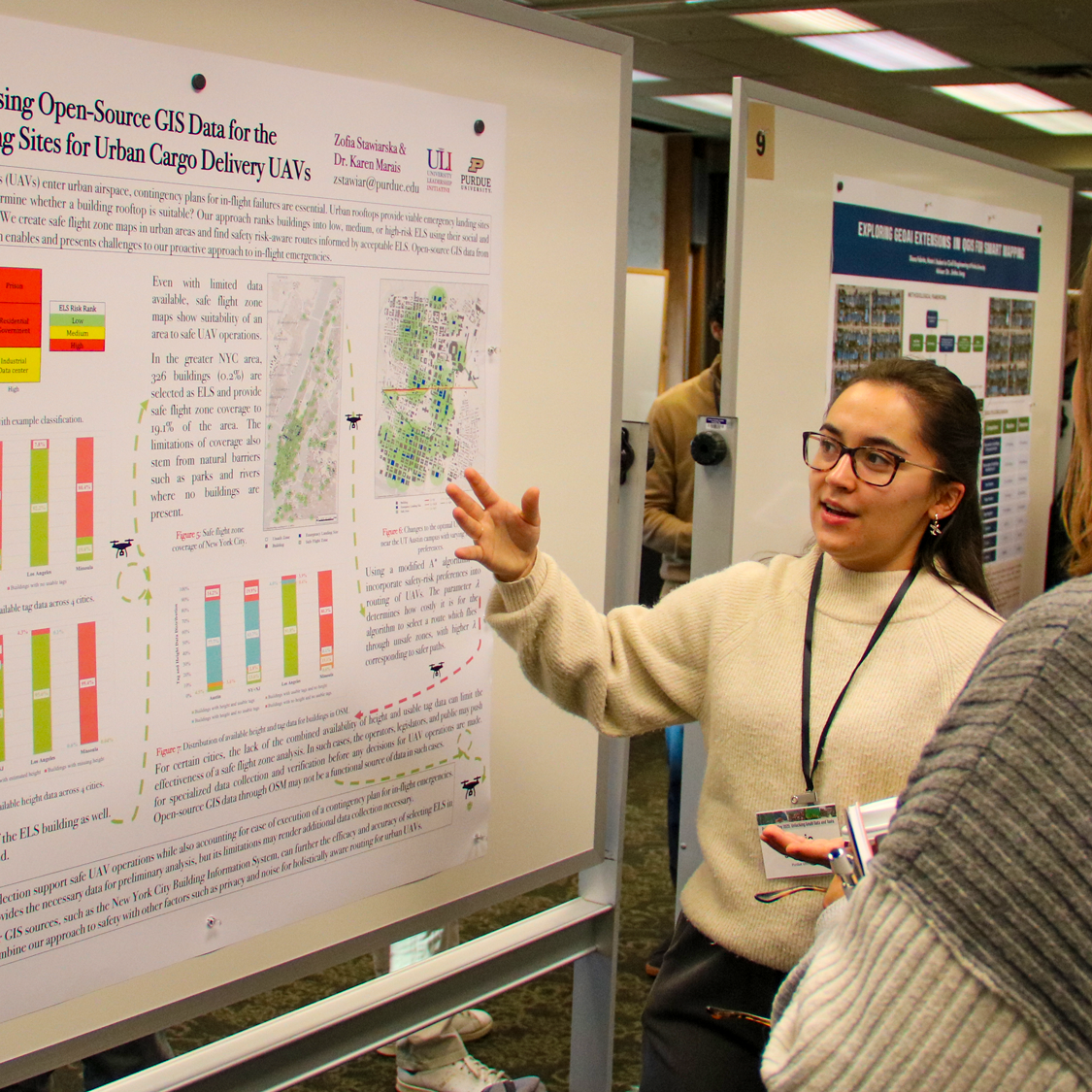 A female student presenting her research poster